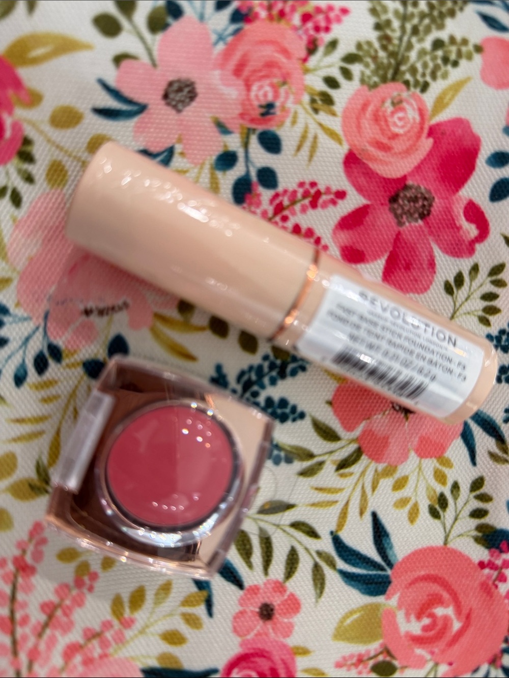 Revolution Pink Cream Blush Stick & Pot Duo, cosmetic bag, and foundation stick